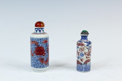 Lot 2003 - Two Chinese underglaze blue and red snuff...
