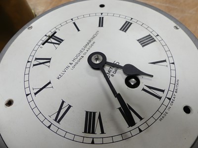 Lot 118 - A metal ship's clock by Kelvin & Hughes...