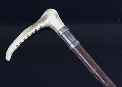 Lot 3518 - An Edwardian riding crop, having a leather...
