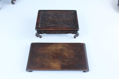 Lot 2094 - A group of Chinese wooden stands, comprising...