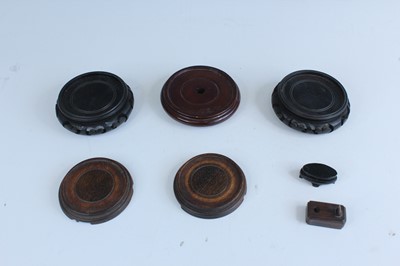 Lot 2094 - A group of Chinese wooden stands, comprising...