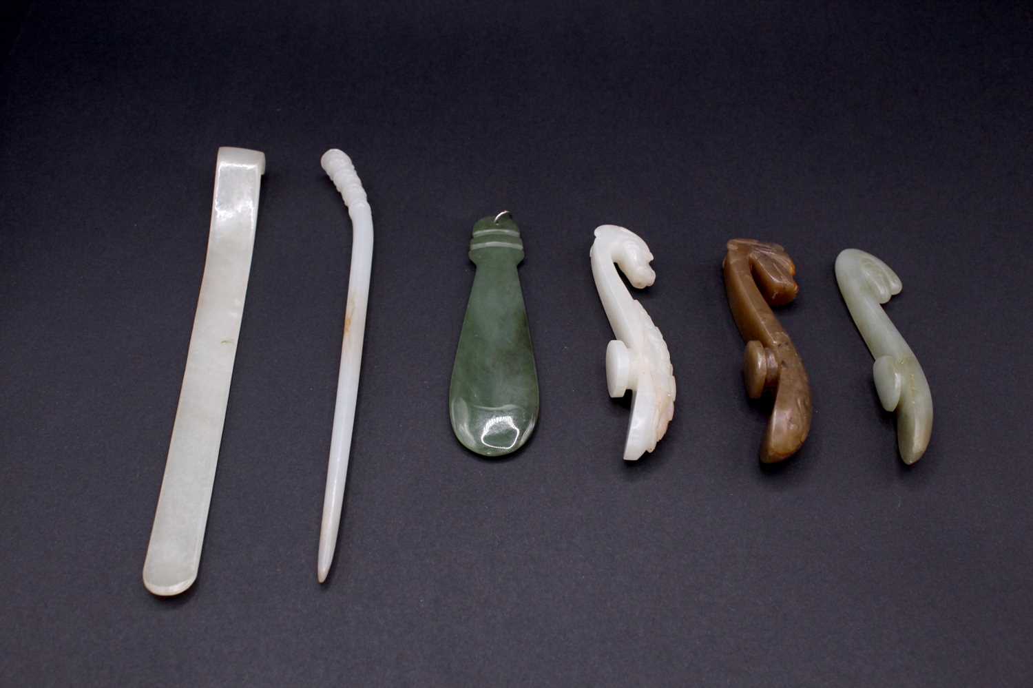 Lot 2047 - A group of six Chinese jade ornaments, Qing...