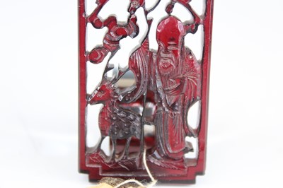 Lot 2051 - A Chinese carved amber ‘immortal and deer’...