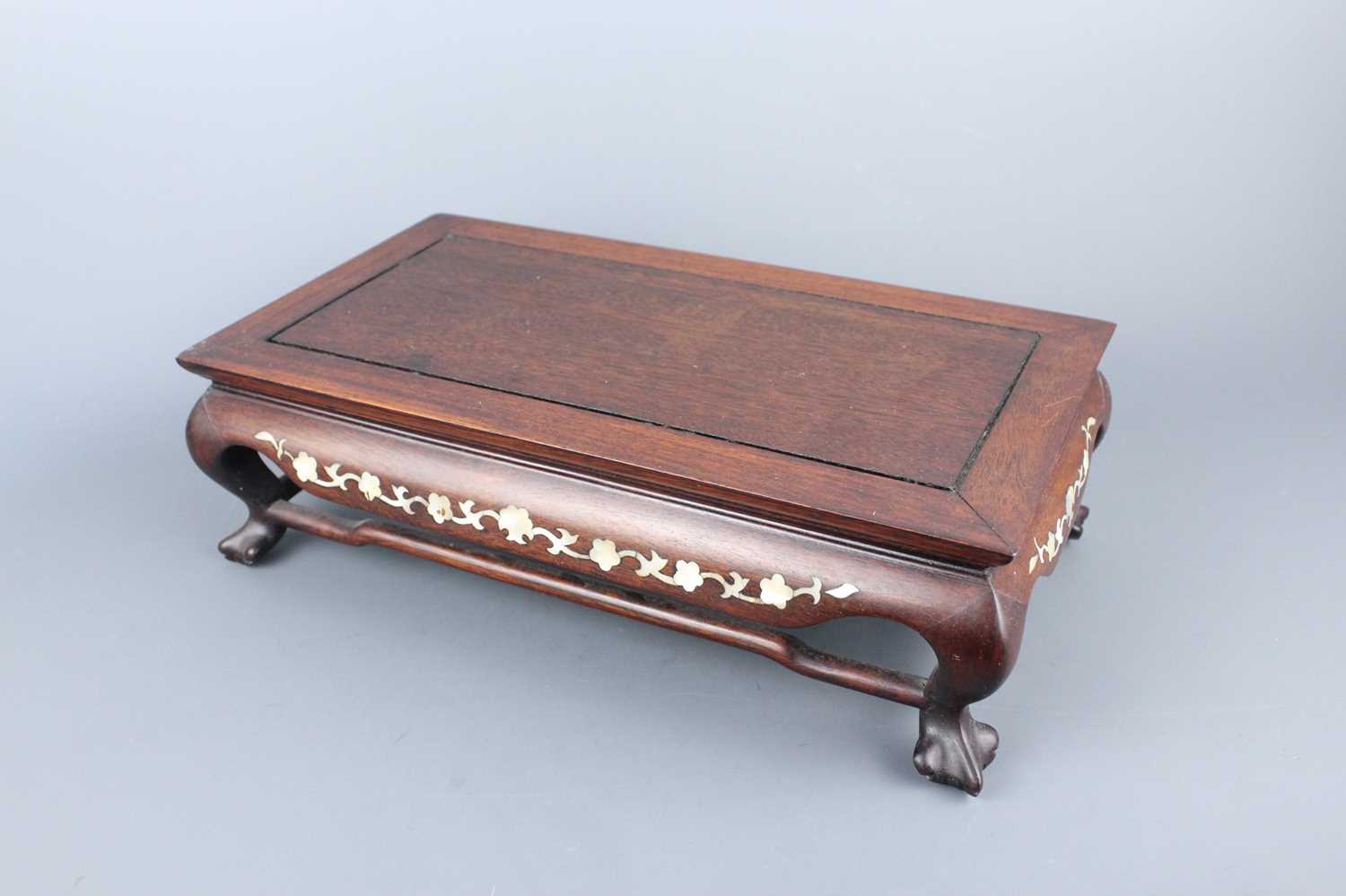 Lot 2092 - A Chinese rectangular wooden stand, 20th...