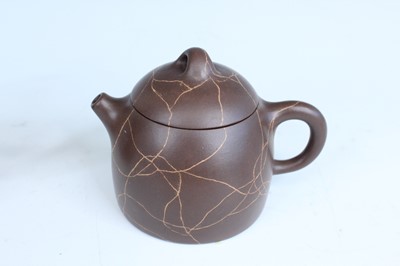 Lot 2055 - Two Chinese Yixing teapots, 20th century,...