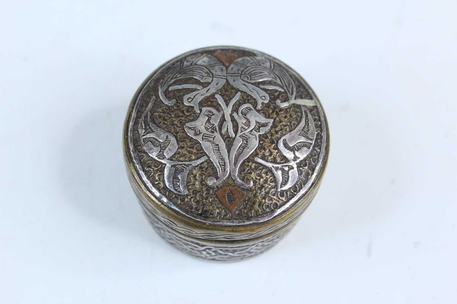 Lot 2215 - A small Persian brass-inlaid box, 19th or...