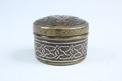 Lot 2215 - A small Persian brass-inlaid box, 19th or...
