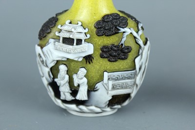 Lot 2012 - Two Chinese overlay glass snuff bottles, Qing...