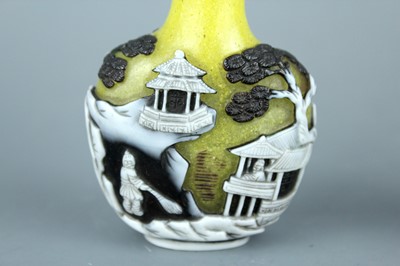 Lot 2012 - Two Chinese overlay glass snuff bottles, Qing...