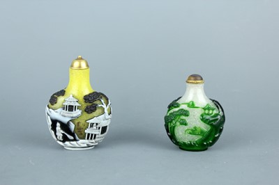 Lot 2012 - Two Chinese overlay glass snuff bottles, Qing...