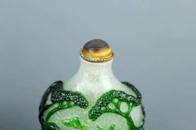Lot 2012 - Two Chinese overlay glass snuff bottles, Qing...