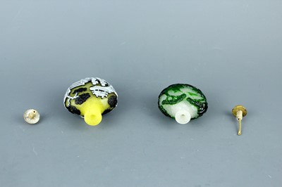 Lot 2012 - Two Chinese overlay glass snuff bottles, Qing...