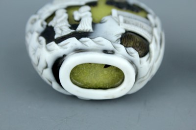 Lot 2012 - Two Chinese overlay glass snuff bottles, Qing...