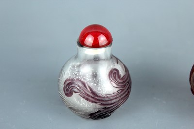 Lot 2013 - Two Chinese ‘dragon and phenix’ glass snuff...
