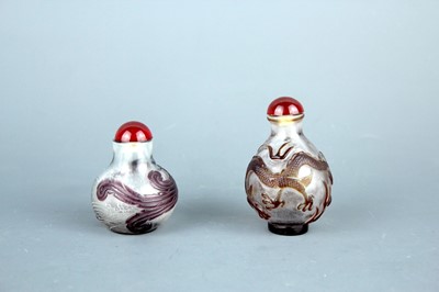 Lot 2013 - Two Chinese ‘dragon and phenix’ glass snuff...
