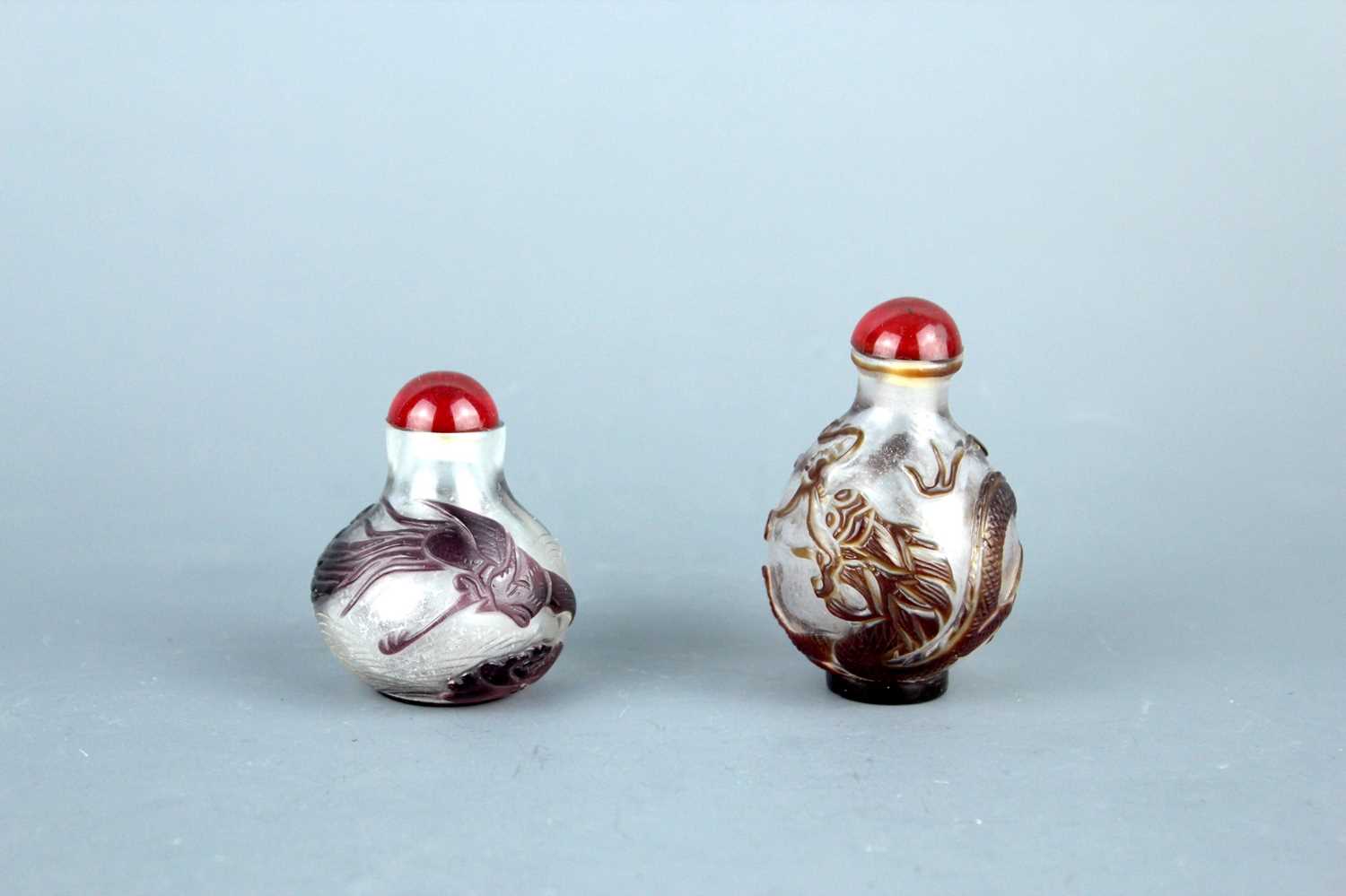 Lot 2013 - Two Chinese ‘dragon and phenix’ glass snuff...