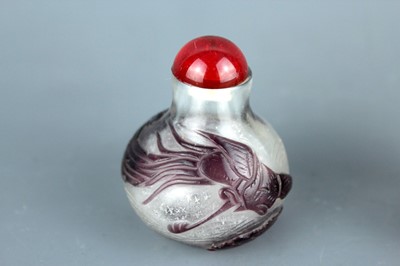 Lot 2013 - Two Chinese ‘dragon and phenix’ glass snuff...