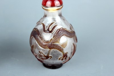 Lot 2013 - Two Chinese ‘dragon and phenix’ glass snuff...