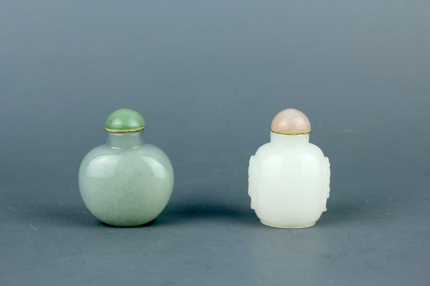 Lot 2016 - Two Chinese jade snuff bottles, Qing Dynasty,...