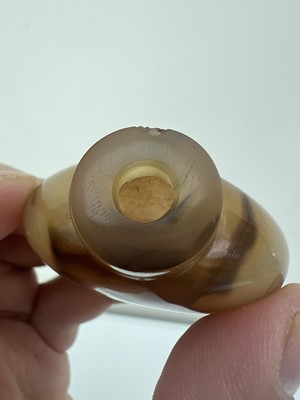 Lot 2017 - Two Chinese agate snuff bottles, 19th or 20th...