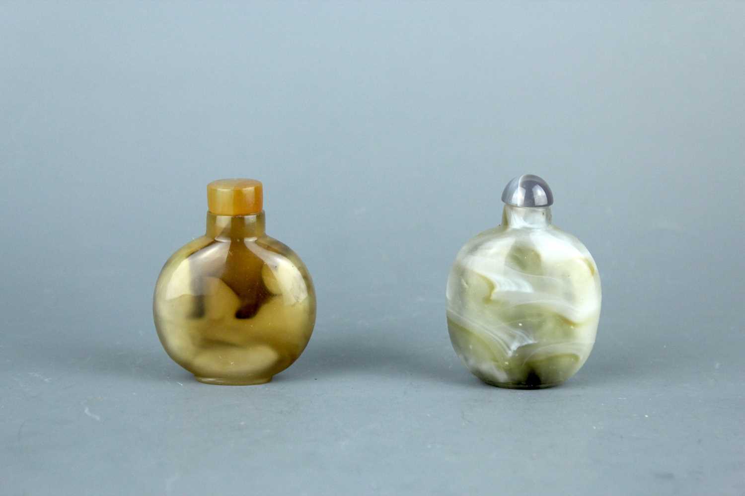 Lot 2017 - Two Chinese agate snuff bottles, 19th or 20th...
