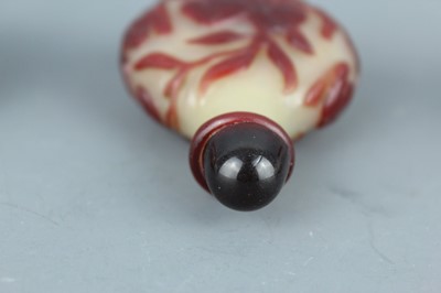 Lot 2019 - A set of three Chinese red overlay white glass...