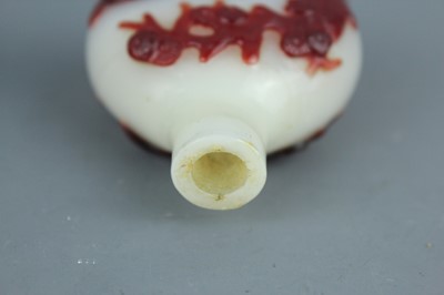 Lot 2019 - A set of three Chinese red overlay white glass...