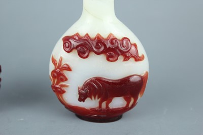 Lot 2019 - A set of three Chinese red overlay white glass...