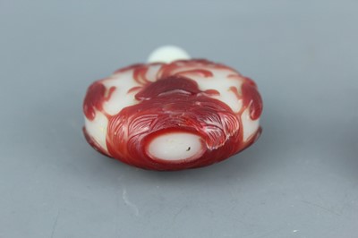 Lot 2019 - A set of three Chinese red overlay white glass...