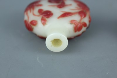 Lot 2019 - A set of three Chinese red overlay white glass...