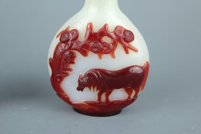 Lot 2019 - A set of three Chinese red overlay white glass...