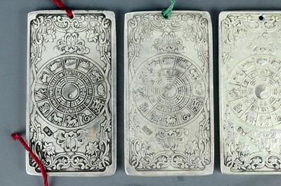 Lot 2058 - Seven Chinese white metal zodiac plaques...