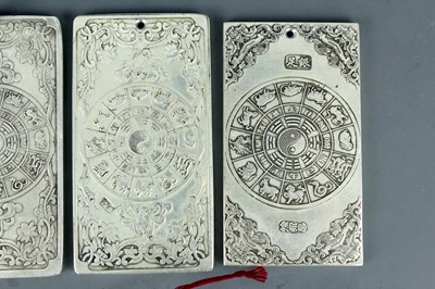 Lot 2058 - Seven Chinese white metal zodiac plaques...