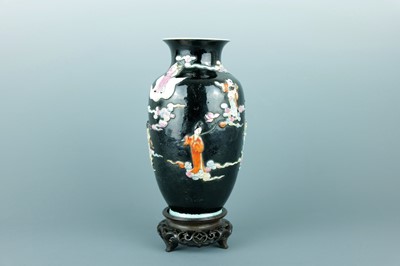 Lot 2080 - A Chinese black ground moulded ‘Eight...