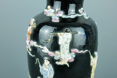 Lot 2080 - A Chinese black ground moulded ‘Eight...