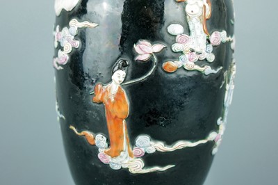 Lot 2080 - A Chinese black ground moulded ‘Eight...