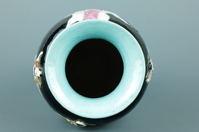 Lot 2080 - A Chinese black ground moulded ‘Eight...