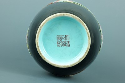 Lot 2080 - A Chinese black ground moulded ‘Eight...