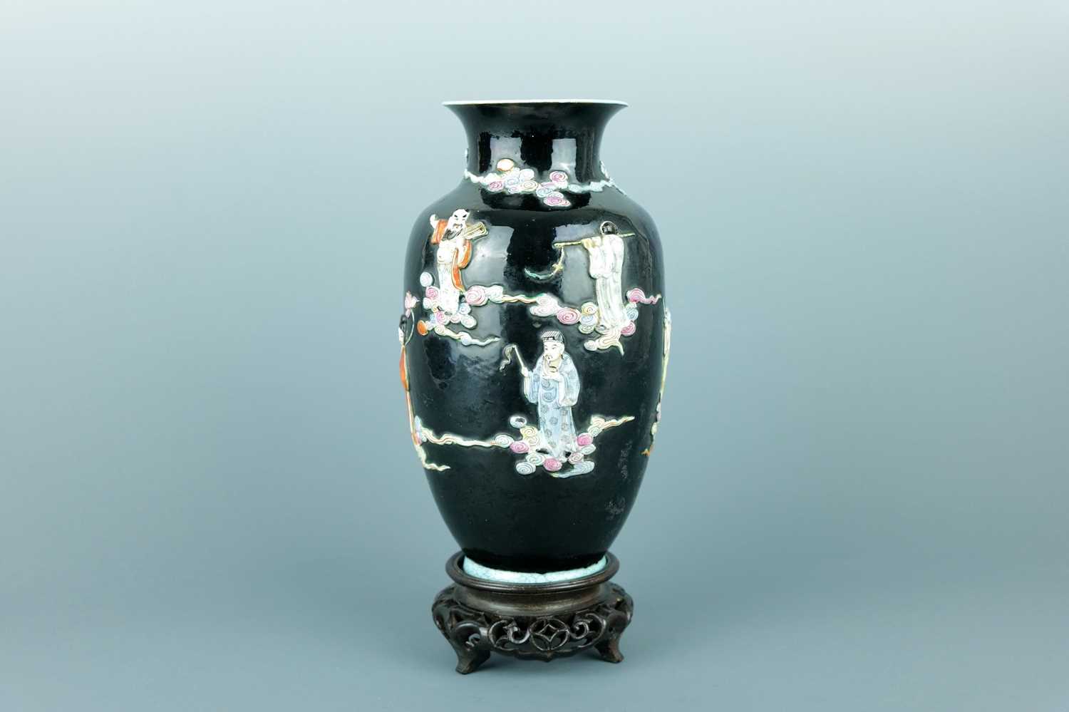 Lot 2080 - A Chinese black ground moulded ‘Eight...