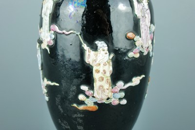 Lot 2080 - A Chinese black ground moulded ‘Eight...