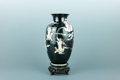 Lot 2080 - A Chinese black ground moulded ‘Eight...