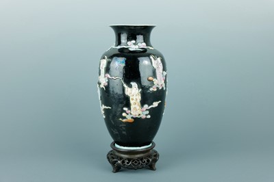 Lot 2080 - A Chinese black ground moulded ‘Eight...