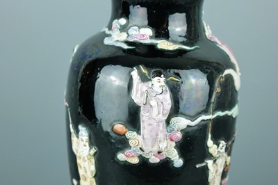 Lot 2080 - A Chinese black ground moulded ‘Eight...