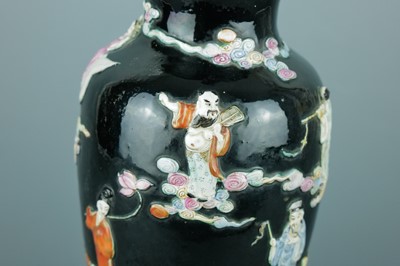 Lot 2080 - A Chinese black ground moulded ‘Eight...