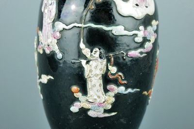 Lot 2080 - A Chinese black ground moulded ‘Eight...