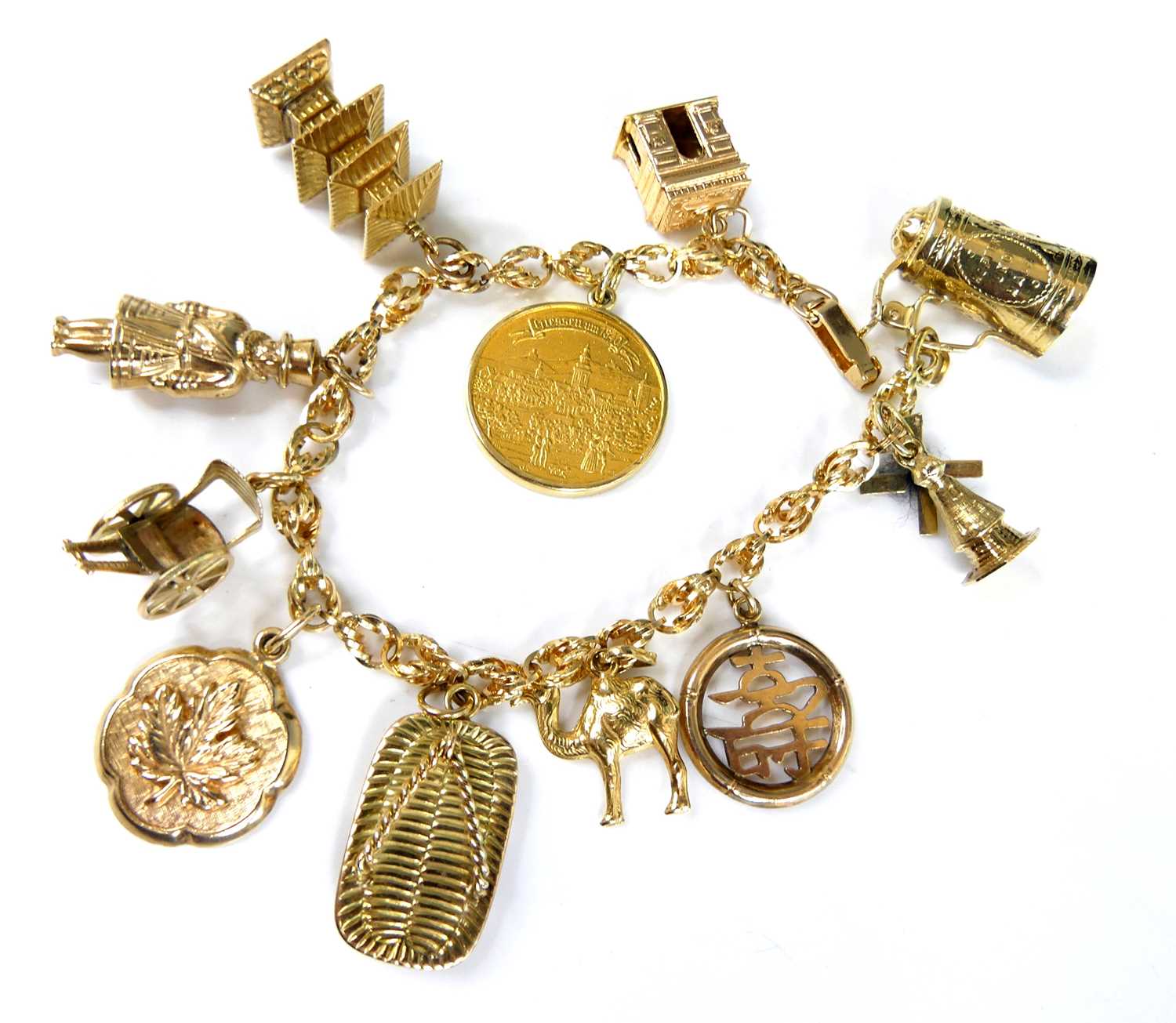 Lot 2582 - A yellow metal ropetwist link bracelet with...