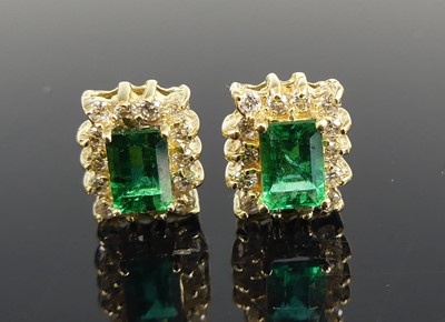 Lot 2633 - A pair of yellow metal, emerald and diamond...