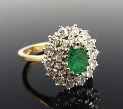 Lot 2632 - An 18ct yellow and white gold, emerald and...