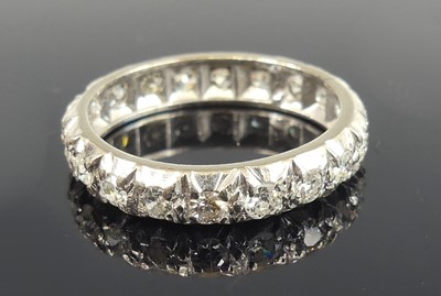 Lot 2634 - A white metal diamond eternity ring,...