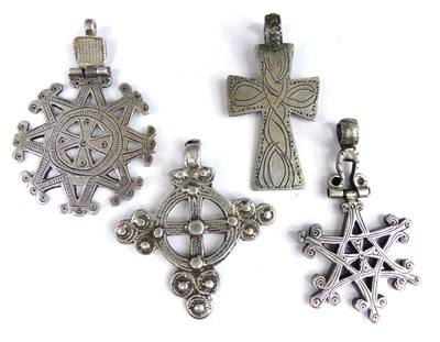 Lot 2645 - Four assorted white metal pendants, comprising...